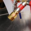 brass 1/2" NPT to swivel garden hose adapter.