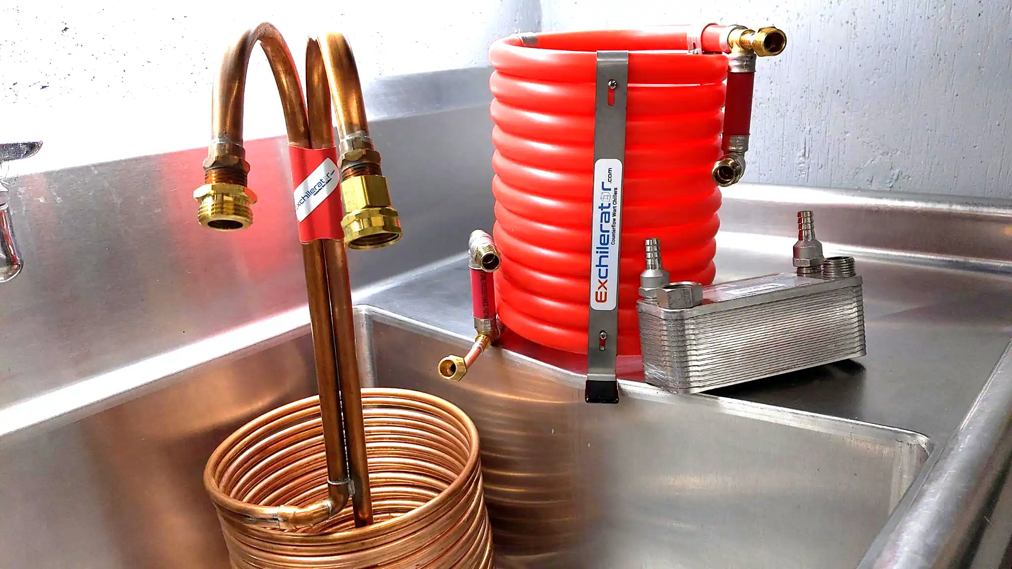 wort chillers on an industrial sink ready to be cleaned.